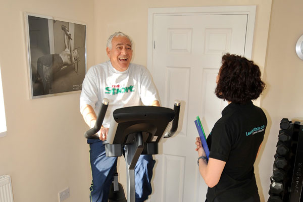Elderly gentleman on an exercise machine